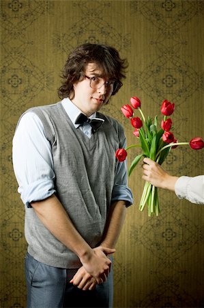 An image of a man in big glasses and red flowers Stock Photo - Budget Royalty-Free & Subscription, Code: 400-04349925