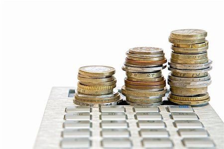 piles of cash pounds - three piles of various coins and calculator Photographie de stock - Aubaine LD & Abonnement, Code: 400-04349929