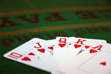 queen of hearts playing card - green casino table with a hand of a royal flush in a poker game Stock Photo - Budget Royalty-Free & Subscription, Code: 400-04349960