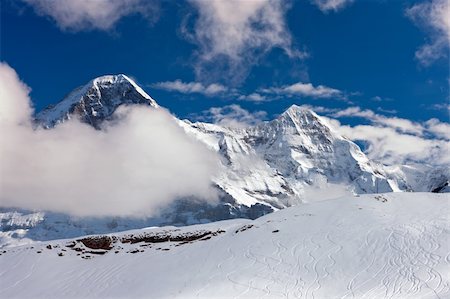 simsearch:400-04340230,k - Ski slope in the background of Mount Eiger. The Eiger is a mountain in the Bernese Alps in Switzerland. Stock Photo - Budget Royalty-Free & Subscription, Code: 400-04340243