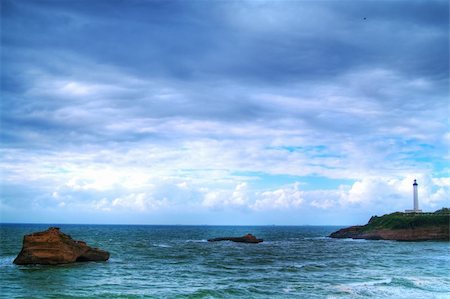 beautiful ocean, lihthouse on cliff Stock Photo - Budget Royalty-Free & Subscription, Code: 400-04340340