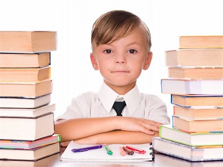 simsearch:400-05078169,k - Six year old boy surrounded by piles of books isolated against a white background Fotografie stock - Microstock e Abbonamento, Codice: 400-04340427