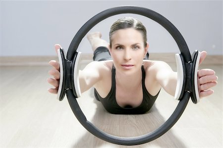 magic pilates ring woman aerobics sport gym exercises on wooden floor Stock Photo - Budget Royalty-Free & Subscription, Code: 400-04340554