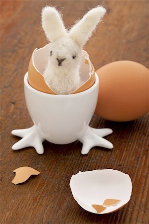 easter humour - Easter decoration concept - woolen bunny hatching from a chicken egg Stock Photo - Budget Royalty-Free & Subscription, Code: 400-04340690
