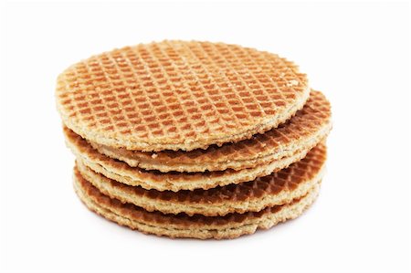A stack of golden round waffles isolated over white background. Stock Photo - Budget Royalty-Free & Subscription, Code: 400-04340704