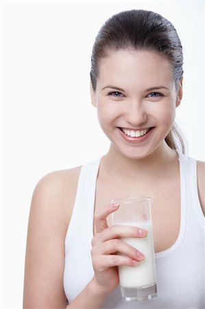 Laughing young woman with a glass of milk Stock Photo - Budget Royalty-Free & Subscription, Code: 400-04340878