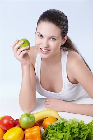 pretty women eating banana - Attractive girl with fruits and vegetables on white background Photographie de stock - Aubaine LD & Abonnement, Code: 400-04340895