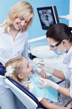 female with dental tools at work - Child treated teeth in the dental clinic Stock Photo - Budget Royalty-Free & Subscription, Code: 400-04340927