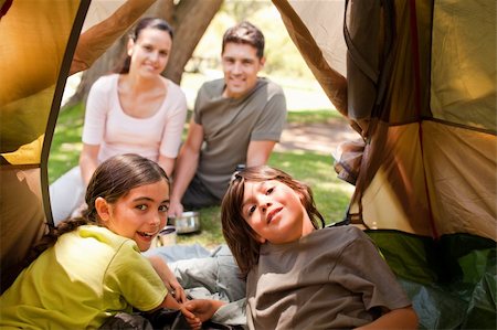father son camping woods - Happy family camping in the park Stock Photo - Budget Royalty-Free & Subscription, Code: 400-04341005