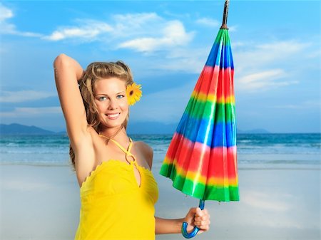 simsearch:400-04907286,k - Beautiful woman in yellow dress with umbrella Photographie de stock - Aubaine LD & Abonnement, Code: 400-04341061