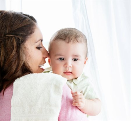 simsearch:400-04118442,k - Cheerful young mother taking care of her adorable baby at home Stock Photo - Budget Royalty-Free & Subscription, Code: 400-04341620