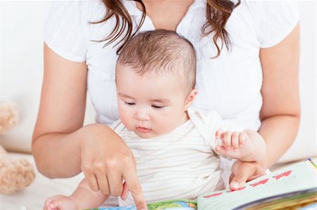 simsearch:400-04118442,k - Attentive mother showing images in a book to her cute little son at home Stock Photo - Budget Royalty-Free & Subscription, Code: 400-04341623