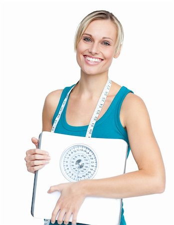 Caucasian young woman holding a weight scale looking at the cmera over white backgroud Stock Photo - Budget Royalty-Free & Subscription, Code: 400-04341650