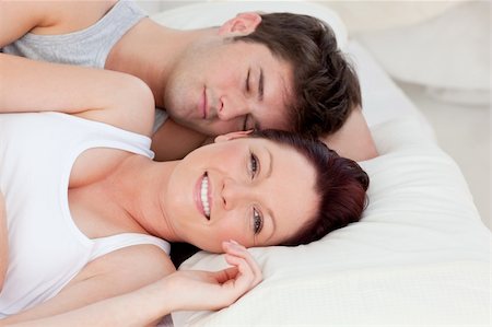 Lovely young couple resting in bed together in the bedroom Stock Photo - Budget Royalty-Free & Subscription, Code: 400-04341693