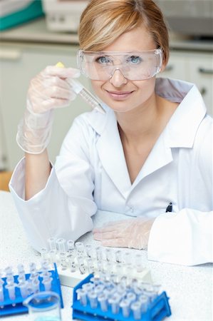 simsearch:400-05669818,k - Self-assured caucasian female scientist holding samples in her laboratory Fotografie stock - Microstock e Abbonamento, Codice: 400-04341789