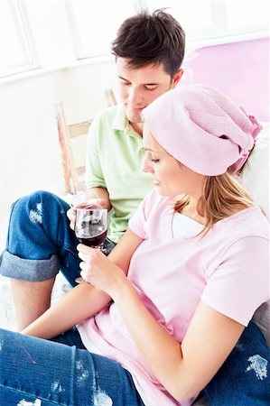 simsearch:400-04878558,k - Happy couple drinking wine on the sofa after painting their new room in their new house Stock Photo - Budget Royalty-Free & Subscription, Code: 400-04341831