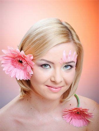 simsearch:400-04599110,k - Close-up of woman green eye. Pink flower on background. Stock Photo - Budget Royalty-Free & Subscription, Code: 400-04341897
