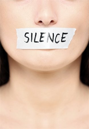simsearch:400-06364563,k - A picture of a female face with a tape on her mouth and a notice "silence" Stock Photo - Budget Royalty-Free & Subscription, Code: 400-04342143