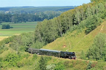 simsearch:400-07680071,k - Beautiful hilly landscape with an old retro steam train Photographie de stock - Aubaine LD & Abonnement, Code: 400-04342241