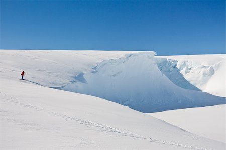 Man moves on skis. Glacier in background. Antarctica Stock Photo - Budget Royalty-Free & Subscription, Code: 400-04342265