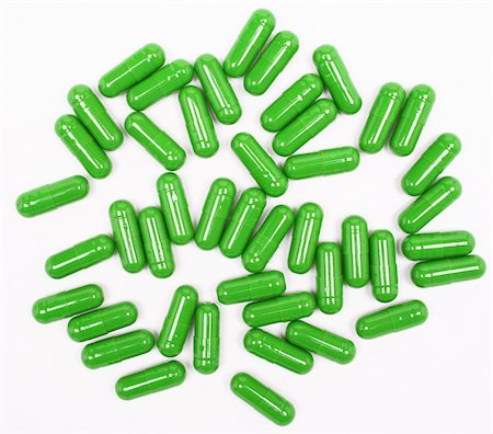 Green pills on white background Photographie de stock - Aubaine LD & Abonnement, Code: 400-04342287