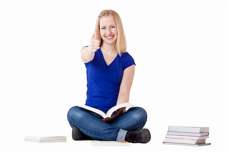 Young beautiful female student sitting on floor and showing thumb up. Isolated on white background. Stock Photo - Budget Royalty-Free & Subscription, Code: 400-04342570