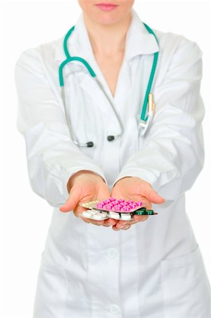 simsearch:400-04880039,k - Doctors hand holding packs of pills isolated on white. Close-up. Foto de stock - Super Valor sin royalties y Suscripción, Código: 400-04343020