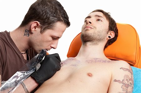 simsearch:400-03921000,k - a horizontal shot of a tattoo artist at work Stockbilder - Microstock & Abonnement, Bildnummer: 400-04343138