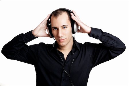 Portrait of a young man listening music with headphones Stock Photo - Budget Royalty-Free & Subscription, Code: 400-04343322