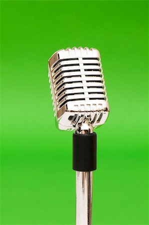 simsearch:400-05884358,k - Vintage microphone against the bright green background Stock Photo - Budget Royalty-Free & Subscription, Code: 400-04343384