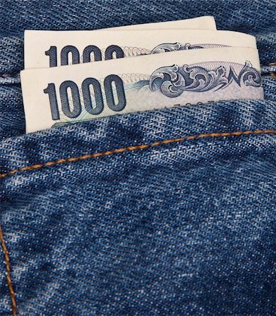 Japanese Yen banknotes sticking out of the pocket of a pair of jeans Stockbilder - Microstock & Abonnement, Bildnummer: 400-04343697