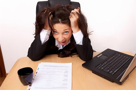 stress coffee - Young woman stressed at work in a black suit Stock Photo - Budget Royalty-Free & Subscription, Code: 400-04343753