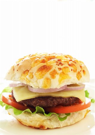 simsearch:400-08114830,k - Tasty hamburger with grilled patty, tomato, cheese and lettuce on white background Stock Photo - Budget Royalty-Free & Subscription, Code: 400-04343784