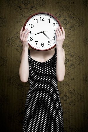 An image of a girl holding a big white clock Fotografie stock - Microstock e Abbonamento, Codice: 400-04354041