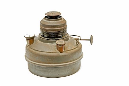 rusting tank - kerosene tank with a burner and a visible indicator of the fuel and the infusion of fuel. This tank was used as a contribution to a small heater warming the room Stock Photo - Budget Royalty-Free & Subscription, Code: 400-04354255