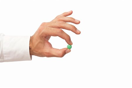 simsearch:400-05074416,k - hand holding a green pill Photographie de stock - Aubaine LD & Abonnement, Code: 400-04354402