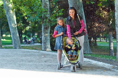 A family walking in the park in the sunny day Stock Photo - Budget Royalty-Free & Subscription, Code: 400-04354491