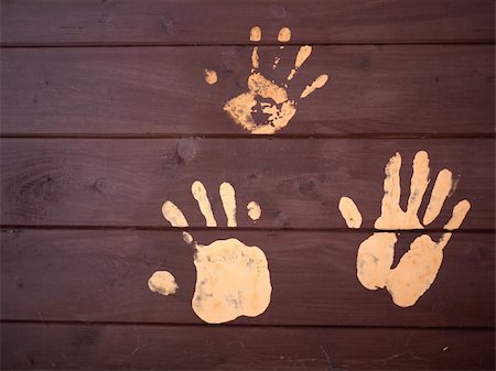 The hand prints of mud on a wooden board Stock Photo - Budget Royalty-Free & Subscription, Code: 400-04354591