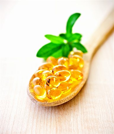 Fish oil a wooden spoon. Stock Photo - Budget Royalty-Free & Subscription, Code: 400-04354859