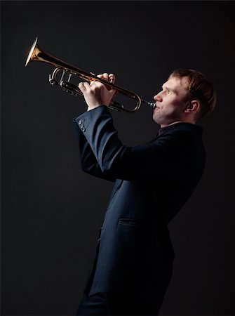 shyshka (artist) - Portrait of a young man playing his Trumpet Photographie de stock - Aubaine LD & Abonnement, Code: 400-04355205