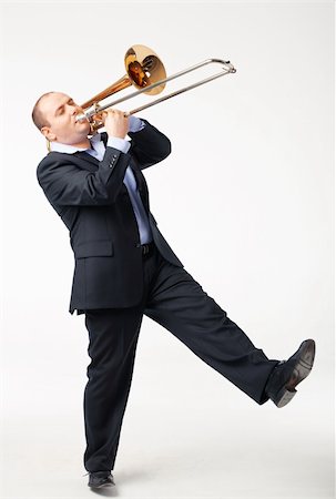 shyshka (artist) - Portrait of a young man playing his trombone on white Photographie de stock - Aubaine LD & Abonnement, Code: 400-04355200