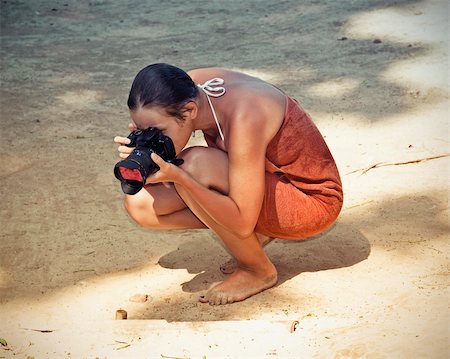young woman take photos at the sand surface Stock Photo - Budget Royalty-Free & Subscription, Code: 400-04355542