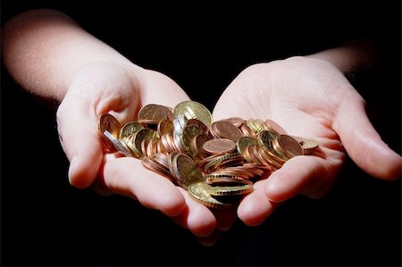 simsearch:400-07123052,k - hands with money coins on a black background Stock Photo - Budget Royalty-Free & Subscription, Code: 400-04355714