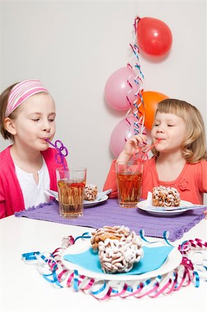 finland food - Girls having a traditional finnish May Day celebration, eating funnel cake, tippaleipa and drinking mead, sima Stock Photo - Budget Royalty-Free & Subscription, Code: 400-04356049