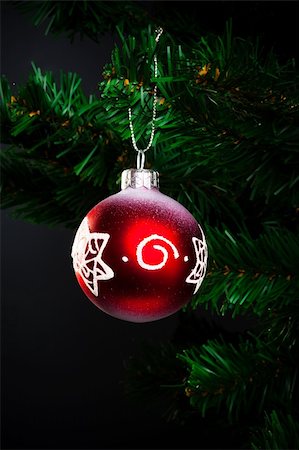 single christmas ball ornament - red ball on the artificial Christmas tree Stock Photo - Budget Royalty-Free & Subscription, Code: 400-04357383