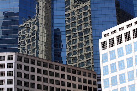 new office building in business center with reflection in glass wall Stock Photo - Budget Royalty-Free & Subscription, Code: 400-04357477