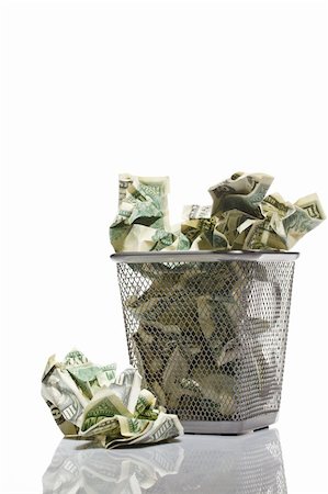 Money in basket. Isolated over white. Stock Photo - Budget Royalty-Free & Subscription, Code: 400-04358043
