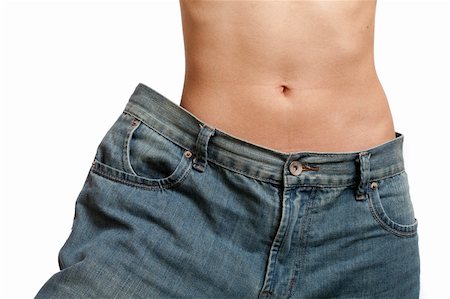 Young woman wearing her old jeans, showing her body after losing weight Foto de stock - Super Valor sin royalties y Suscripción, Código: 400-04359107