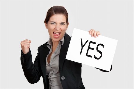 Business young woman showing a paper card with the word YES Stock Photo - Budget Royalty-Free & Subscription, Code: 400-04359589