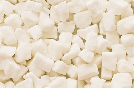 simsearch:400-04359670,k - White sugar cubes arranged at the background Photographie de stock - Aubaine LD & Abonnement, Code: 400-04359670